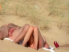 Couple flirts and fondles at the Crimean nude beach