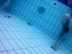 Fantastic asses underwater at a nudist pool