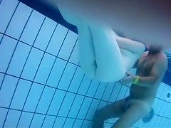 Fantastic asses underwater at a nudist pool