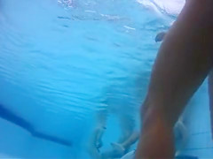 Fantastic asses underwater at a nudist pool