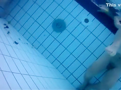 Fantastic asses underwater at a nudist pool