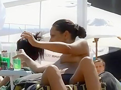 Nice natural boobs on a smoking babe at the pool