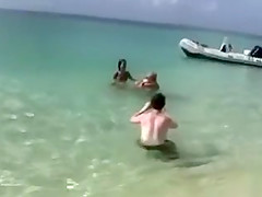 Naked models have fun on a beach vacation