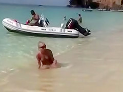 Naked models have fun on a beach vacation