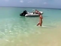 Naked models have fun on a beach vacation