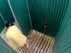 Dark haired bombshell takes a cold shower