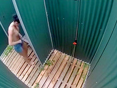 Dark haired bombshell takes a cold shower