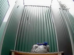 Dark haired bombshell takes a cold shower