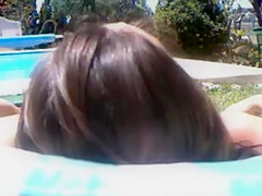 Husband filming nudist wife sunbathing in the backyard