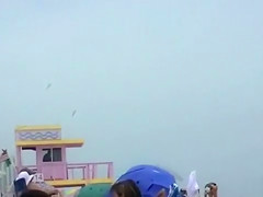 Naked black and white women filmed at the beach