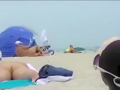 Naked black and white women filmed at the beach