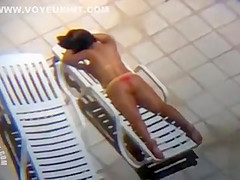 Long zoom on her tanned pair of buttocks