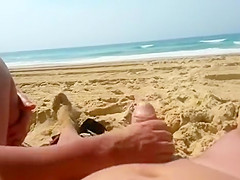 Vigorous wife gives her husband a good handjob