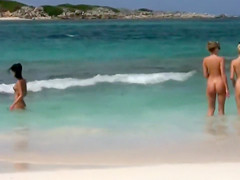 Flawless naked lasses take a dip in the ocean