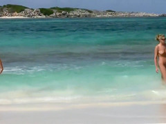 Flawless naked lasses take a dip in the ocean