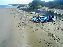 Cumshot on the ass of a girlfriend at the beach