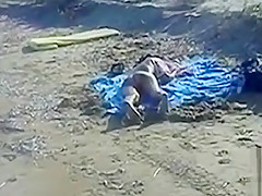 Cumshot on the ass of a girlfriend at the beach