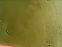 Cumshot on the ass of a girlfriend at the beach