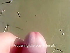 Cumshot on the ass of a girlfriend at the beach