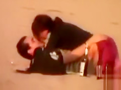 Rubbing the pussy on boyfriend's cock on the public beach