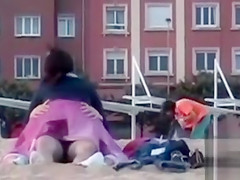 Rubbing the pussy on boyfriend's cock on the public beach