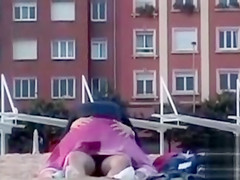 Rubbing the pussy on boyfriend's cock on the public beach