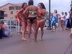 Three cuties with big asses on the boardwalk