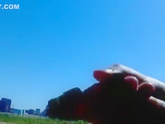 Ejaculating on a topless woman on the beach