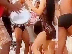 Hot Latina chicks dancing at a beach party