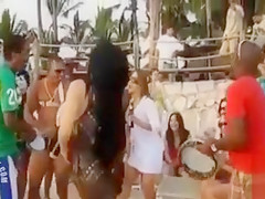 Hot Latina chicks dancing at a beach party