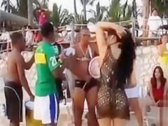 Hot Latina chicks dancing at a beach party