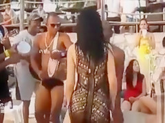 Hot Latina chicks dancing at a beach party