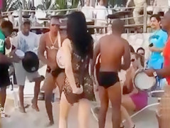 Hot Latina chicks dancing at a beach party