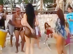 Hot Latina chicks dancing at a beach party
