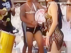 Hot Latina chicks dancing at a beach party