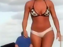 Bubble butt Brazilian chick in a sexy bikini at the beach