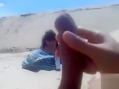 Masturbating to a stranger on the beach