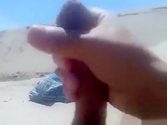 Masturbating to a stranger on the beach
