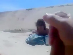 Masturbating to a stranger on the beach