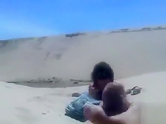 Masturbating to a stranger on the beach