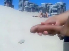 Masturbating to a stranger on the beach