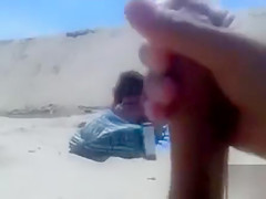Masturbating to a stranger on the beach