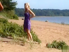 Naked blonde gives an amazing blowjob on the beach