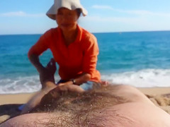 Older Asian bitch massages a guy's hairy legs admiring his big cock