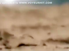 Brunette at the beach filmed when dealing several guys