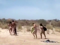 Brunette at the beach filmed when dealing several guys