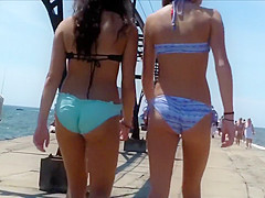 British coed girls on a vacation wear tight bikinis to the beach