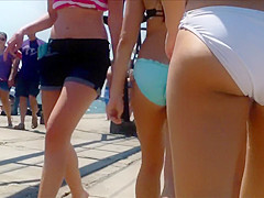 British coed girls on a vacation wear tight bikinis to the beach