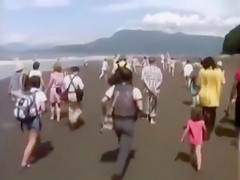 Naked performance art on the beach