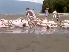 Naked performance art on the beach